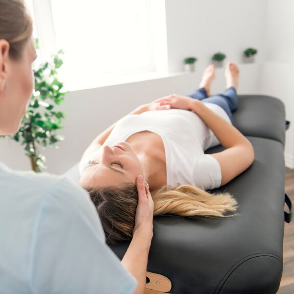 Chiropractor giving woman a treatment