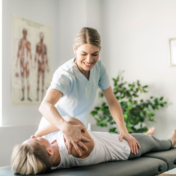 Petts Wood Chiropractor giving a patient a chiropractic treatment for a fee