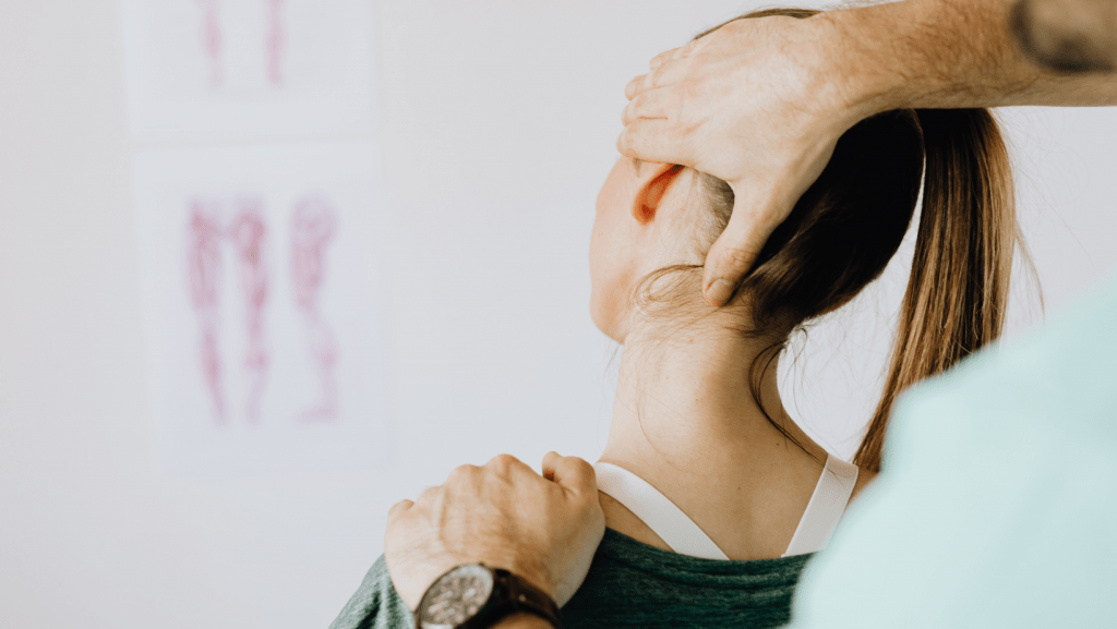 Chiropractic Treatments for Nect Pain Tension Headaches Linked with Neck Pain: Your Petts Wood Chiropractor Can Help Chiropractor stretching a woman's neck to help treat her tension headaches and neck pain.